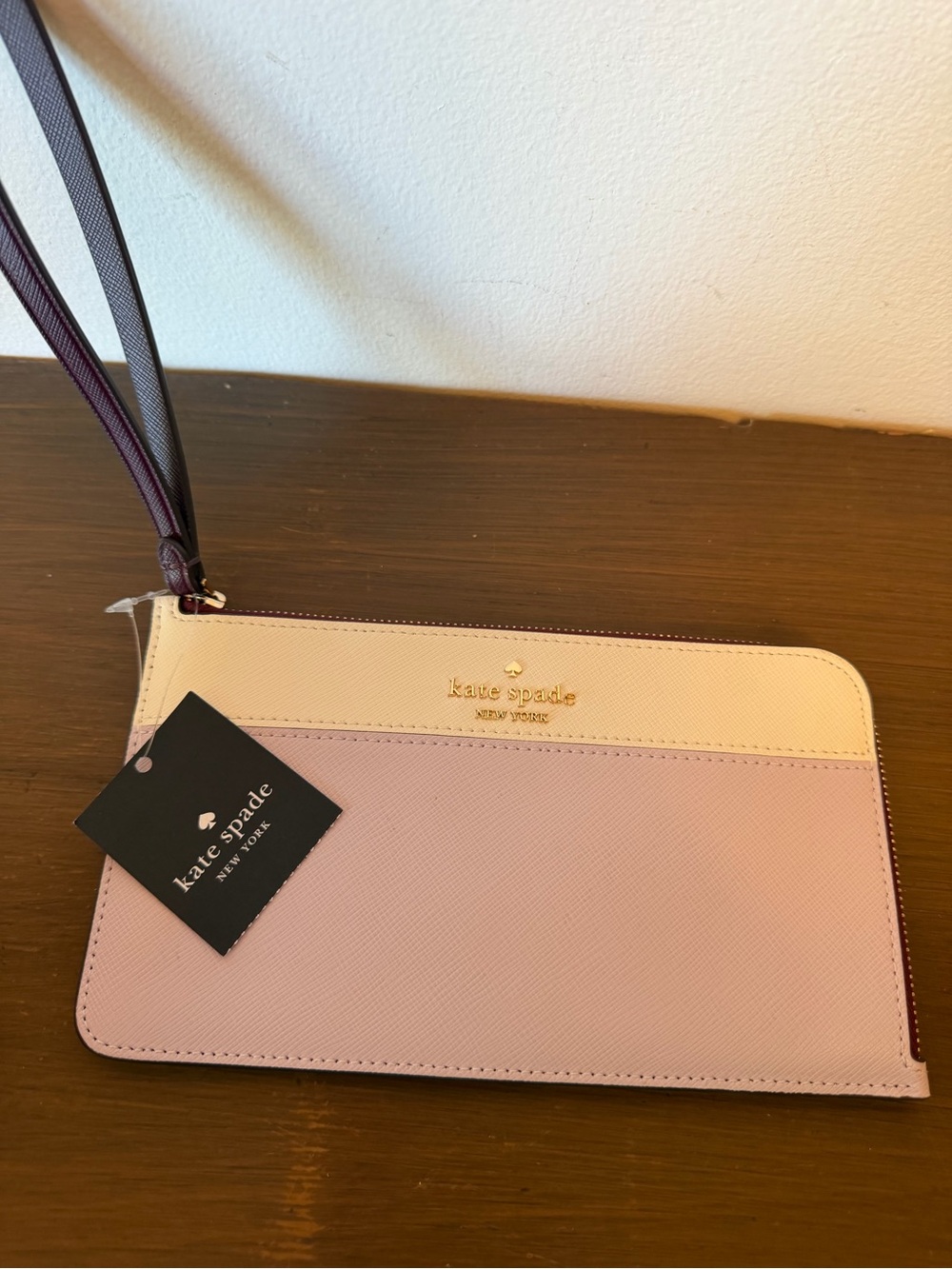 kate spade two-tone pink and cream wristlet with wrist strap